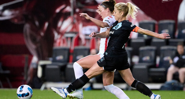 McCall Zerboni wins the ball off a Chicago Red Starts player