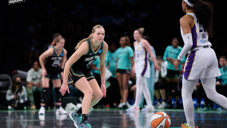 Marine Johannes plays defense in WNBA game.