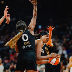 NY Liberty center Jonquel Jones tries to score over three Las Vegas Aces players