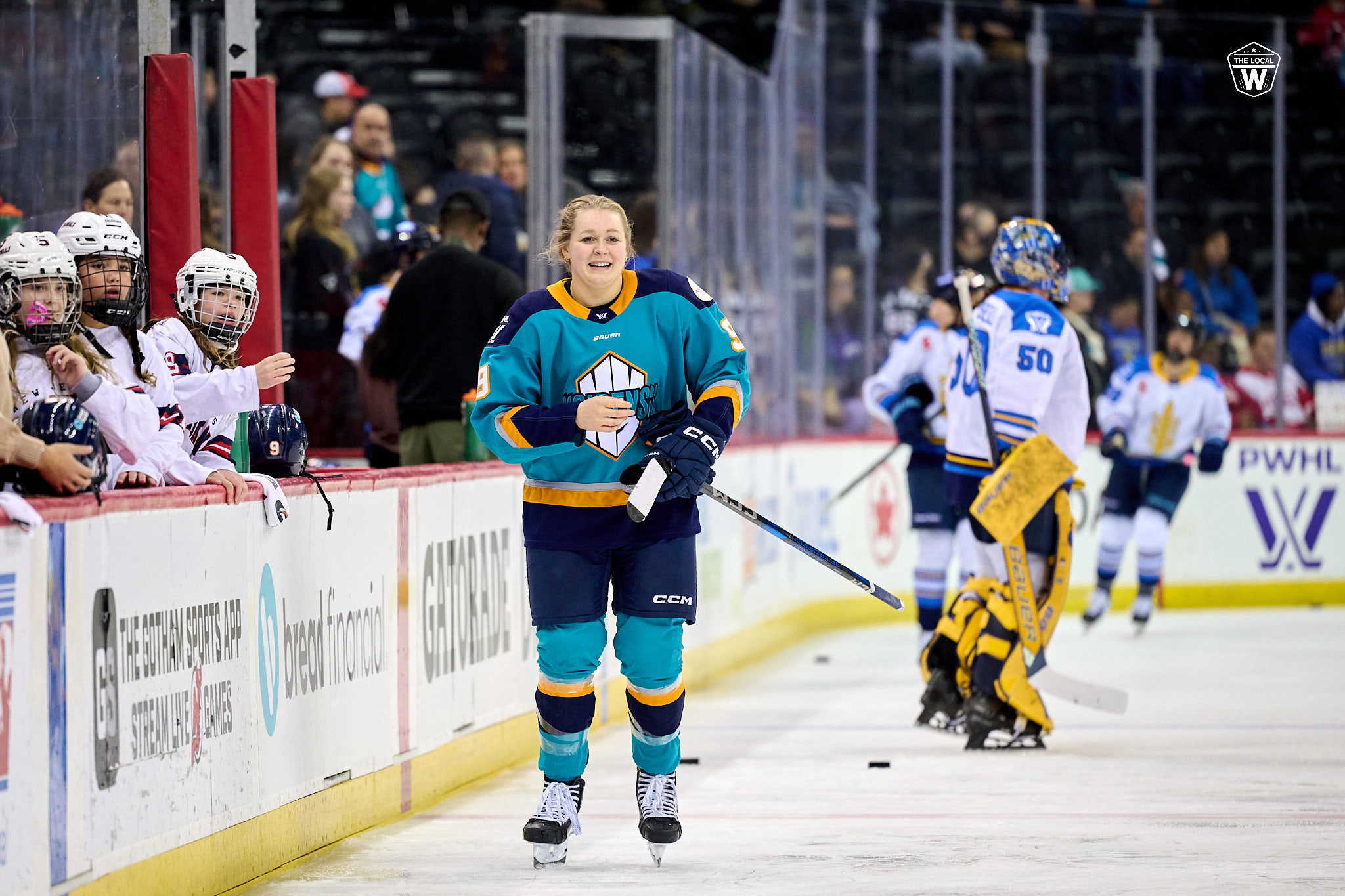 Jessie Eldridge skates by Toronto Sceptres bench